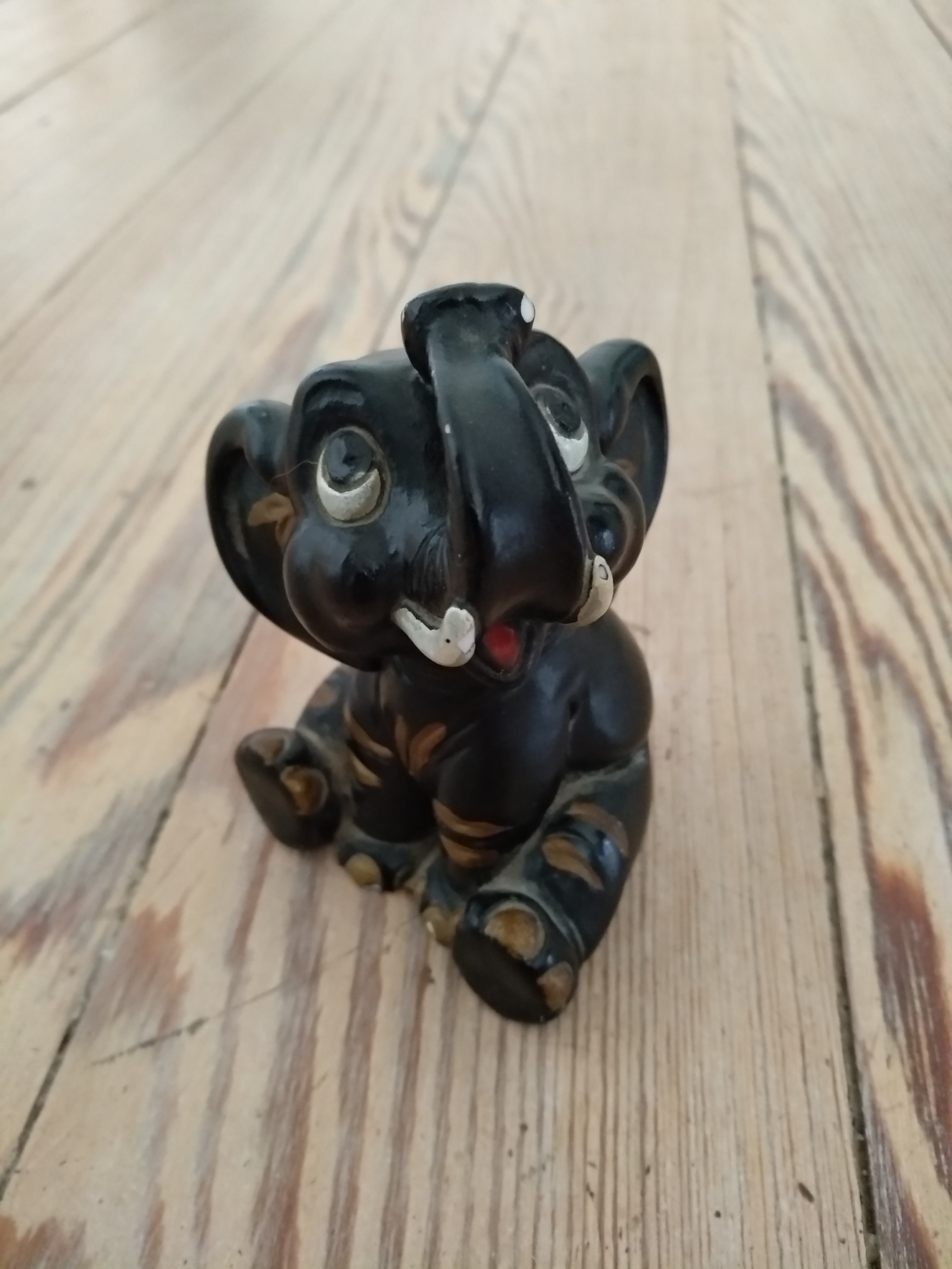 Seated chalkware figurine of elephant
