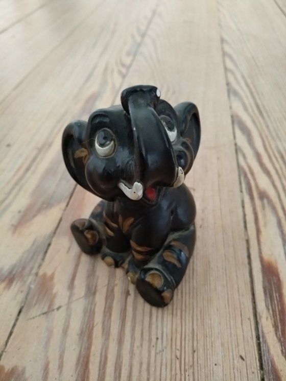 Seated chalkware figurine of elephant