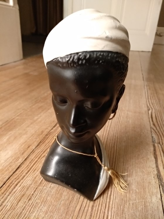 Lady bust figurine with white head scarf and necklace