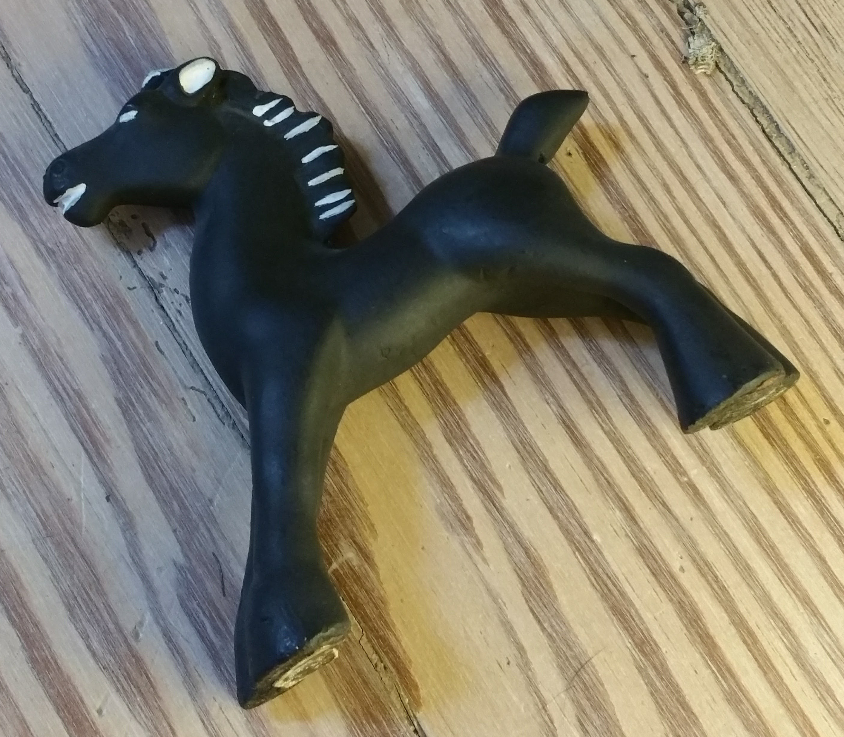 Black chalkware figurine of a horse