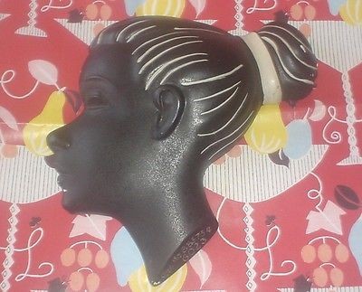 Black chalkware wall plaque