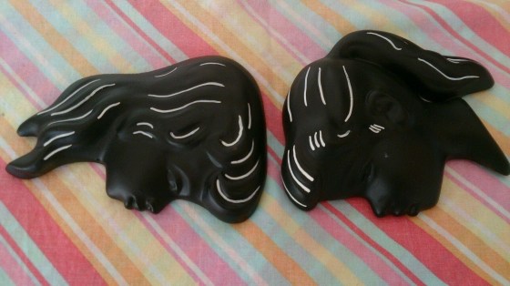 Black chalkware wall plaques
