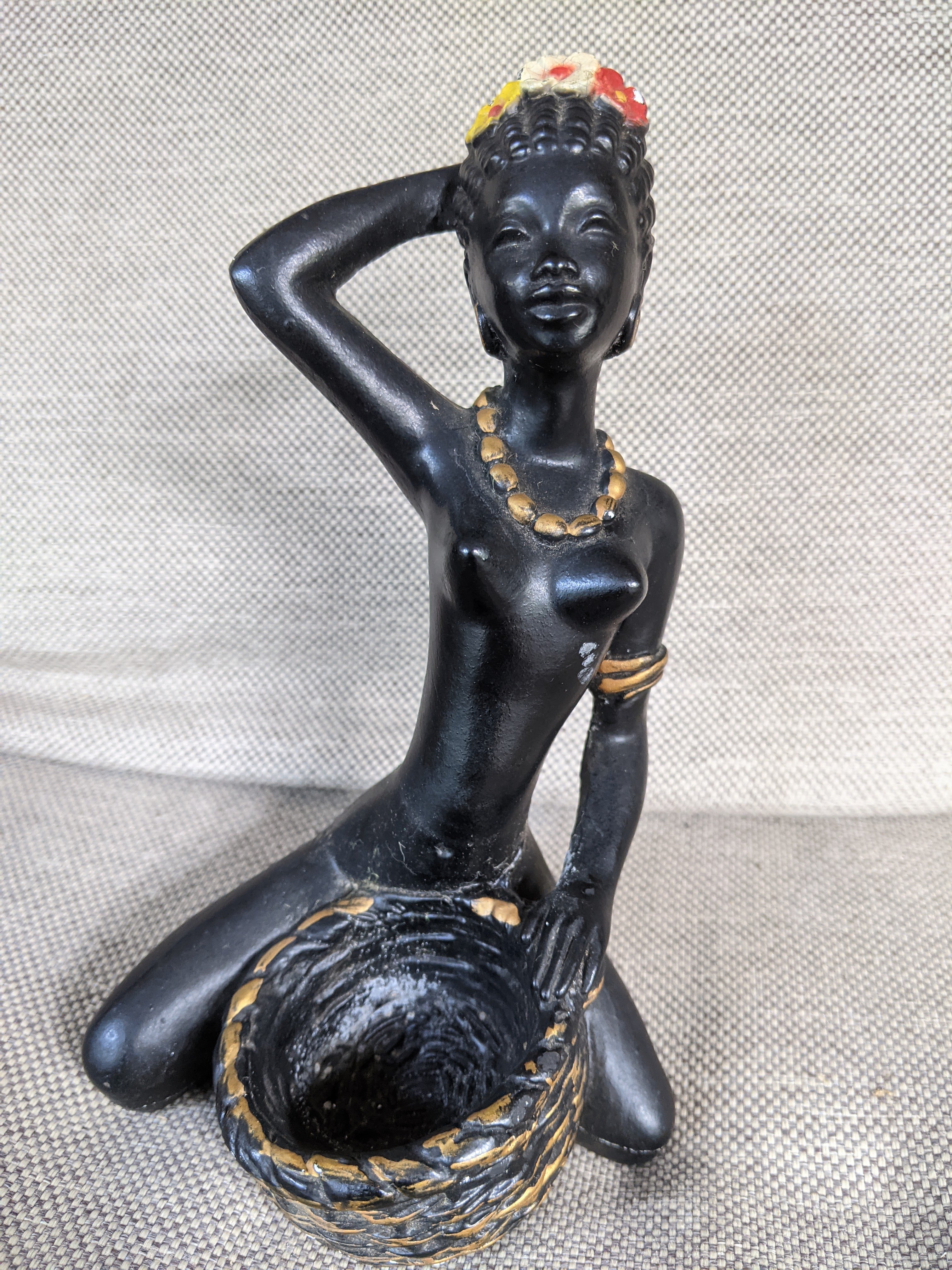 Kneeling lady with bowl figurine made of chalkware with flowers in her hair and gold embossed necklace