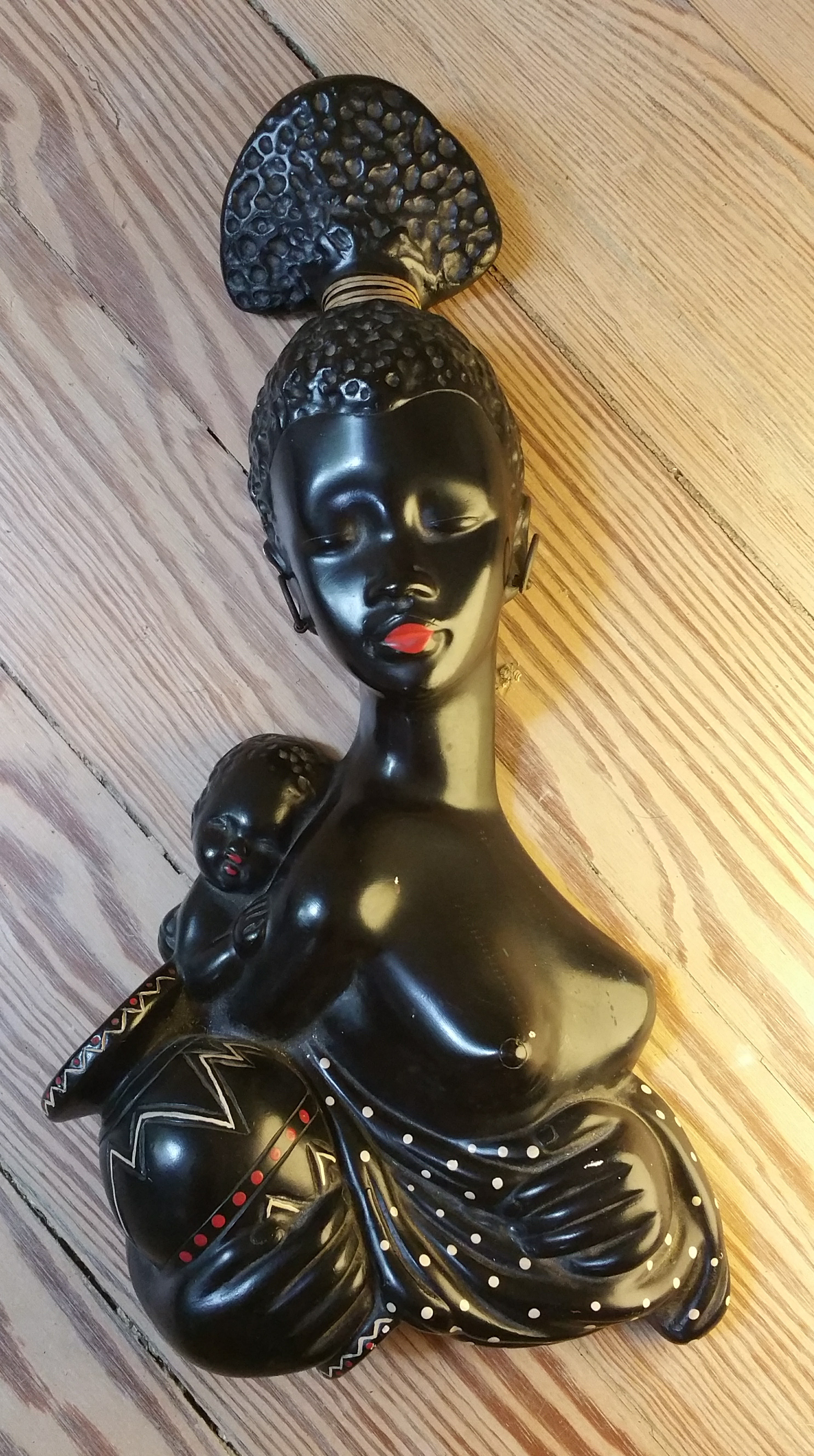 Black chalkware figurine wall plaque