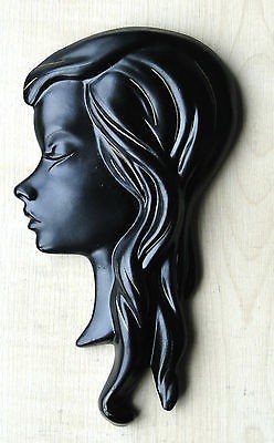 Black chalkware wall plaque