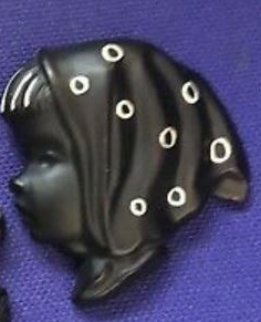 Black chalkware wall plaque