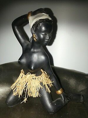 Black chalkware figurine with grass skirt
