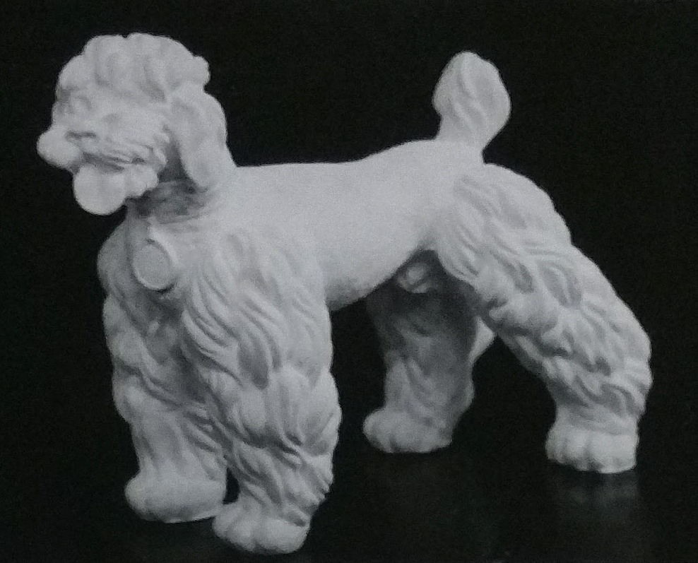 Raw chalkware figurine of a poodle