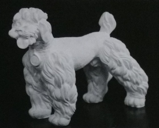 Raw chalkware figurine of a poodle
