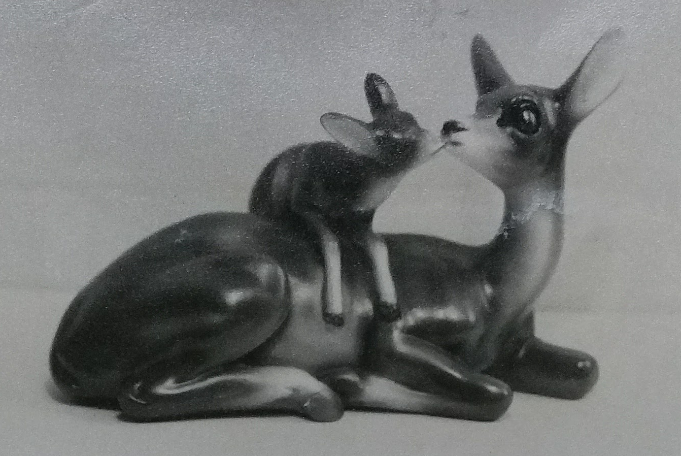 Adult and child reindeer chalkware statue