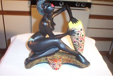 Lady figurine holding vase