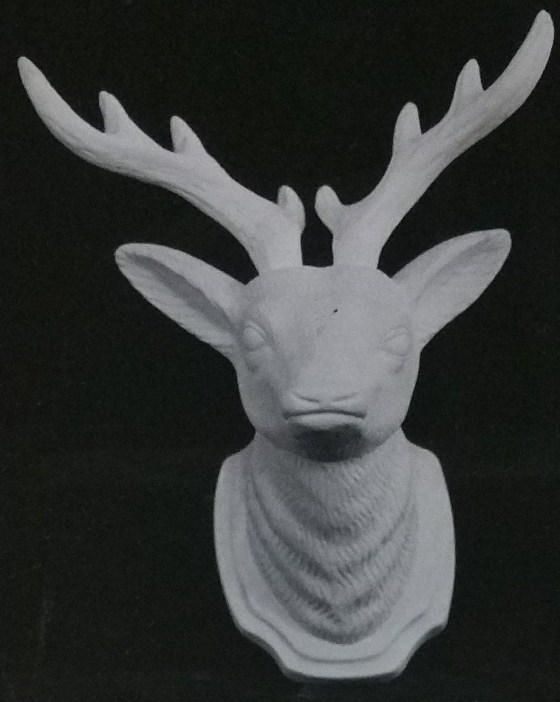 Raw chalkware reindeer statue