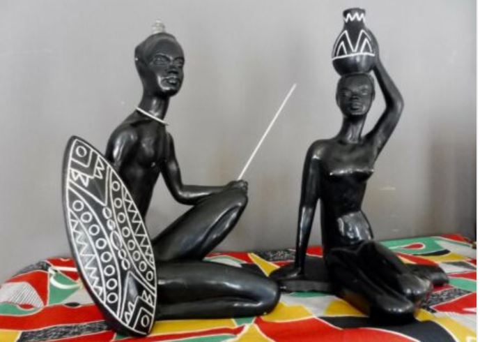 2 black chalkware statues