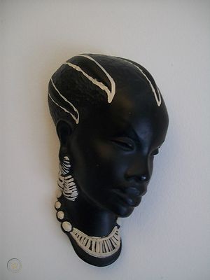 Black chalkware wall plaque