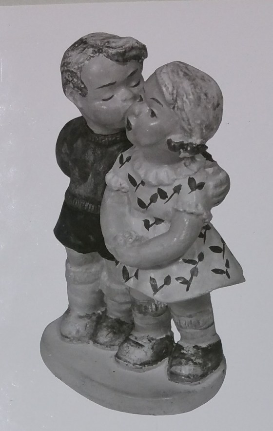 Boy and girl figurine