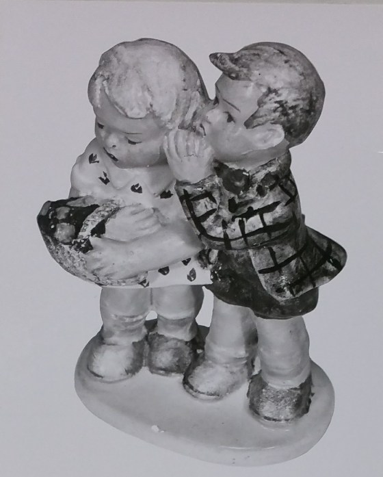 Boy and girl figurine