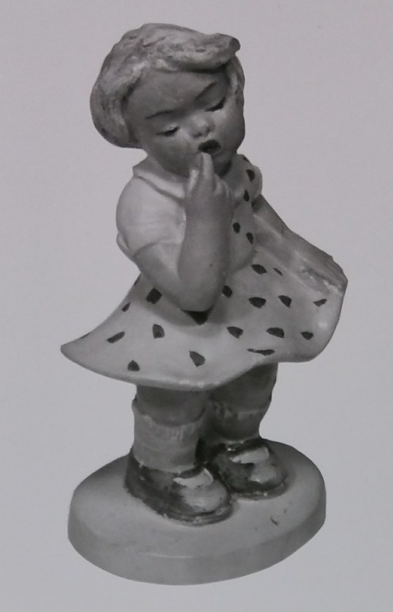 Raw chalkware girl statue