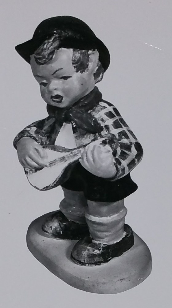 Boy musician figurine