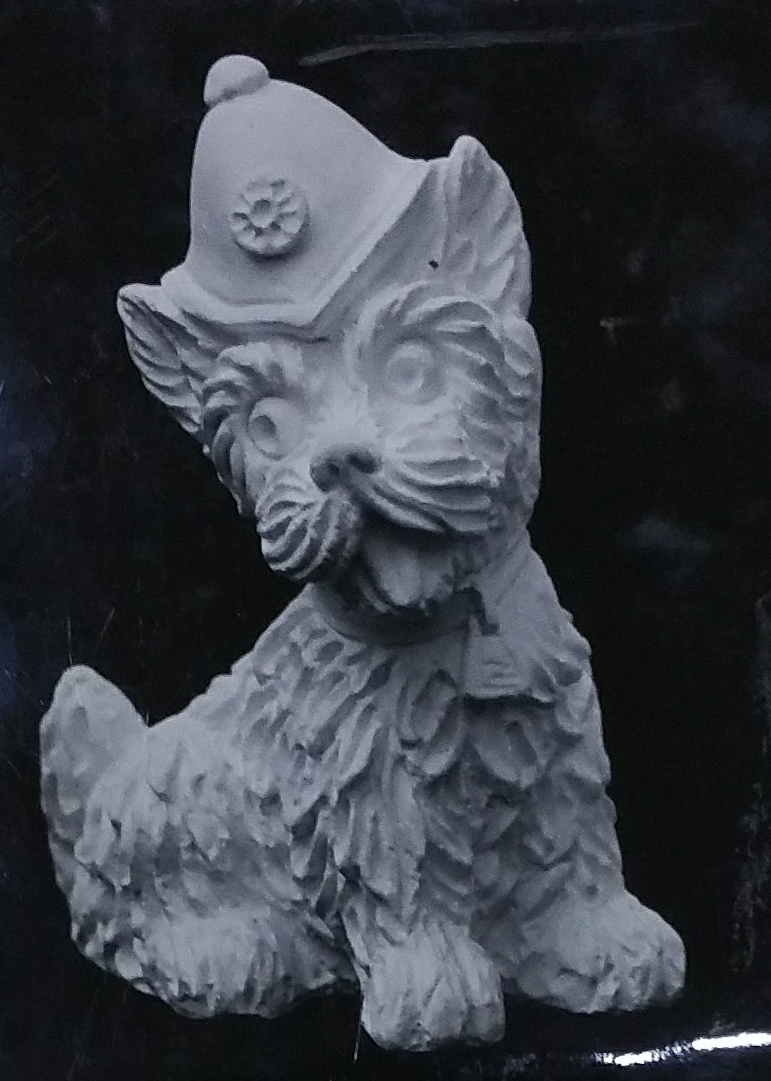 Raw chalkware dog statue