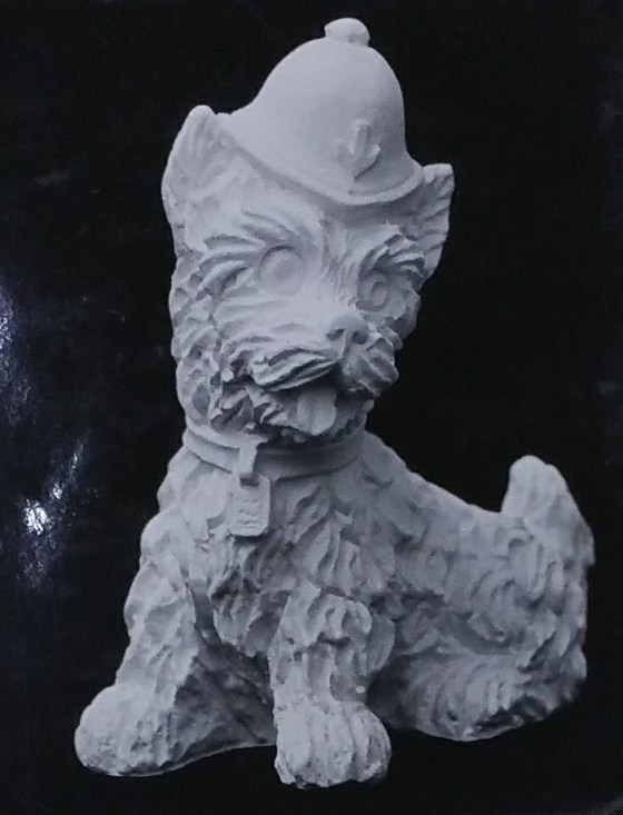 Raw chalkware dog statue