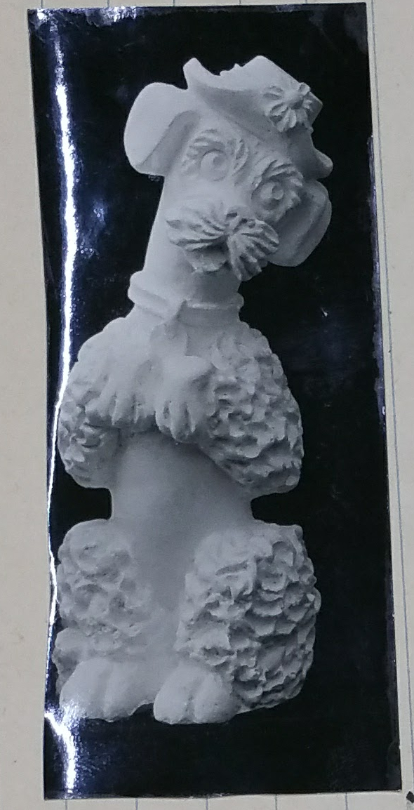 Raw chalkware dog statue