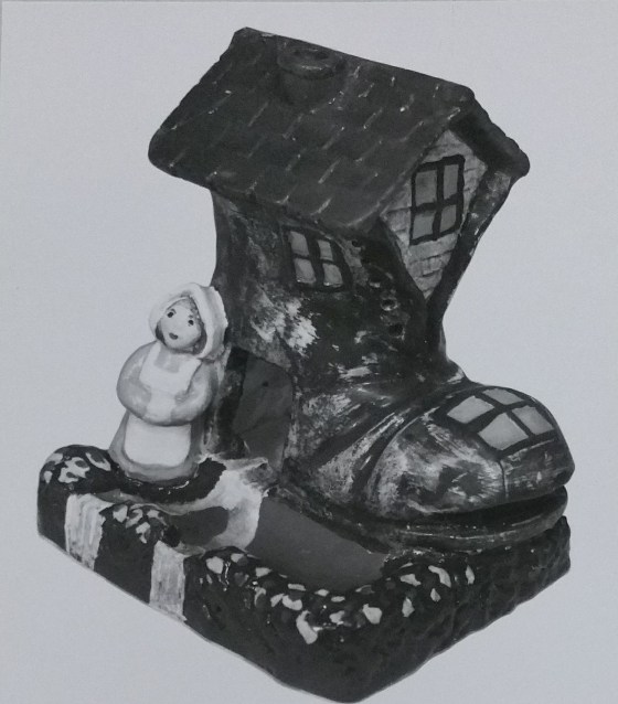 Old woman and shoe chalkware