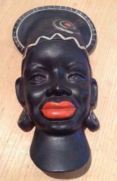 Black chalkware wall plaque