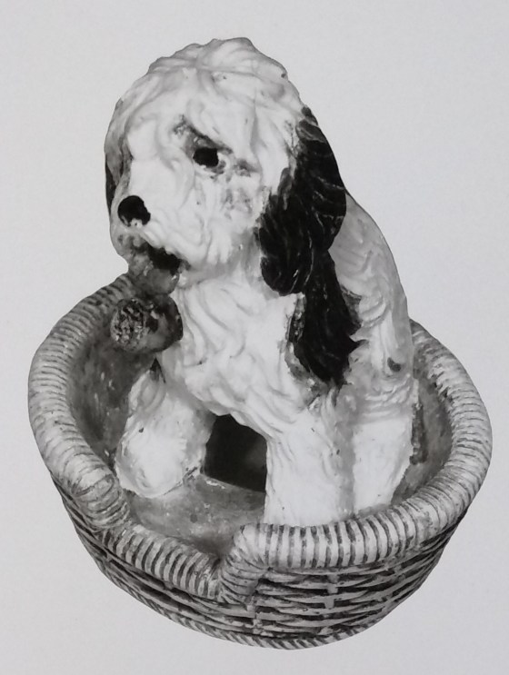 Dog in basket figurine