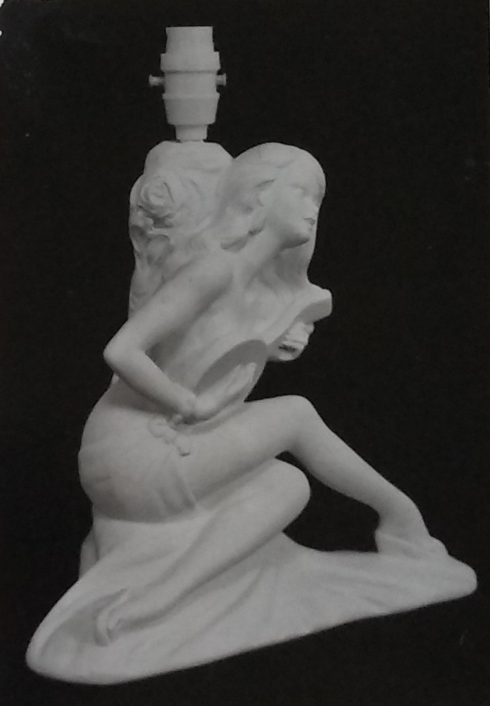 Raw white chalkware statue lamp