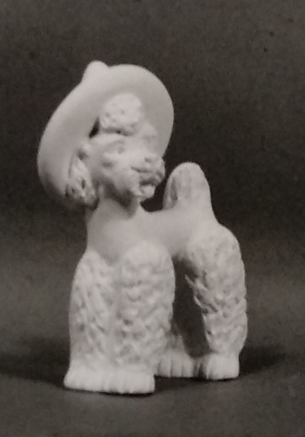 White figurine of poodle in chalkware