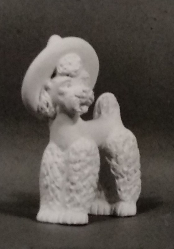 White figurine of poodle in chalkware