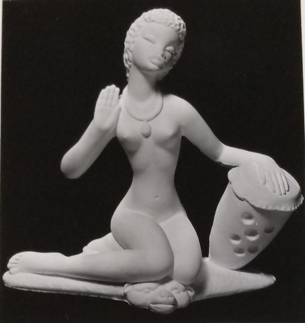 Seated lady chalkware statue