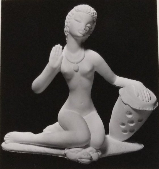 Seated lady chalkware statue
