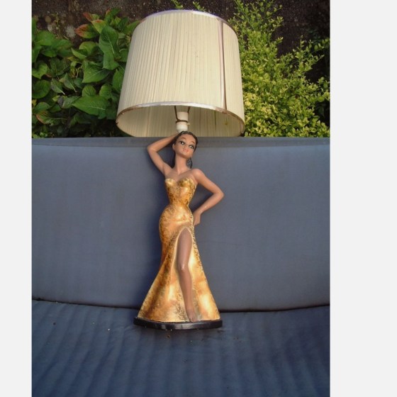 Chalkware lamp of a lady with yellow dress split to the thigh