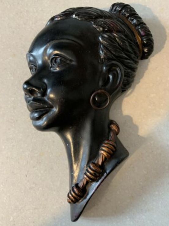 Black chalkware wall plaque