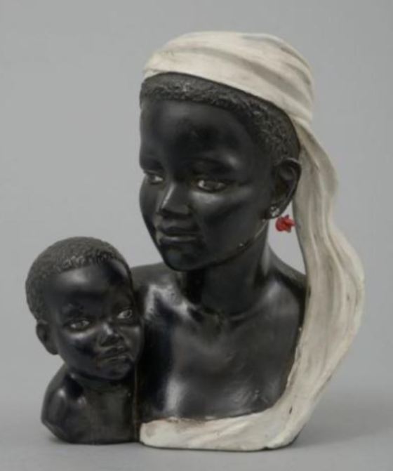 Lady bust in black chalkware holding a baby