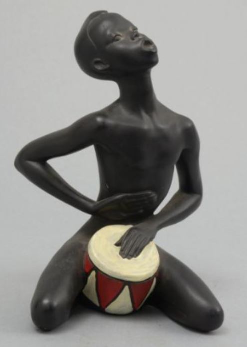 Kneeling drummer in chalkware with white and red drum