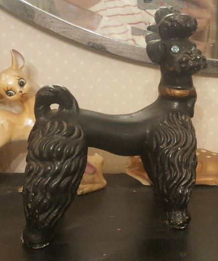 Black chalkware poodle with gold necklace