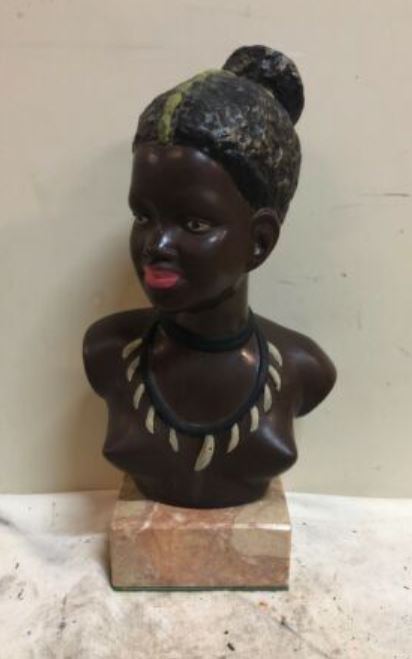 Lady bust in black chalkware and tooth shaped necklace