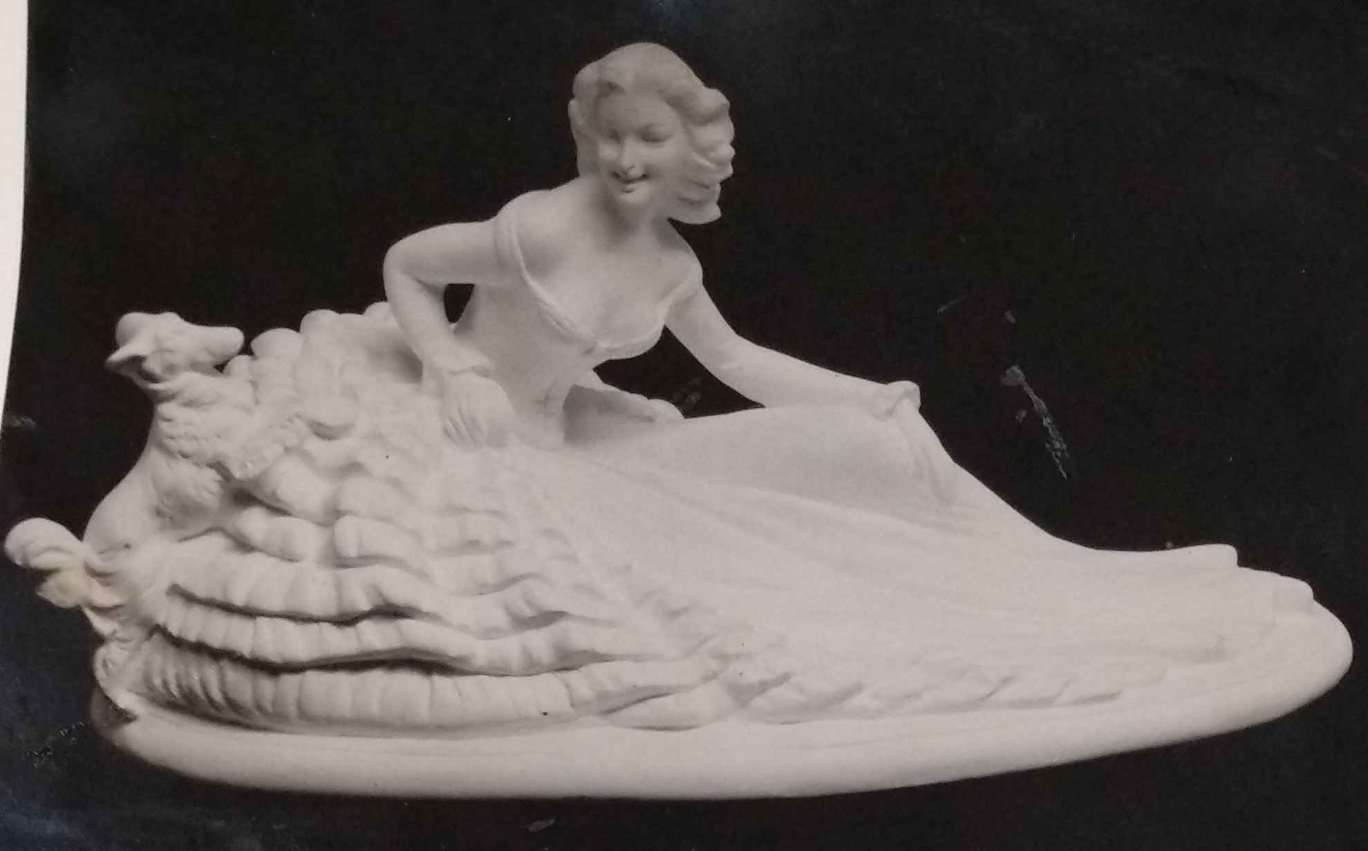 White ceramic girl figurine with sheep