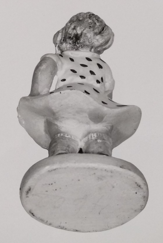 Chalkware of a lady with polka dot dress