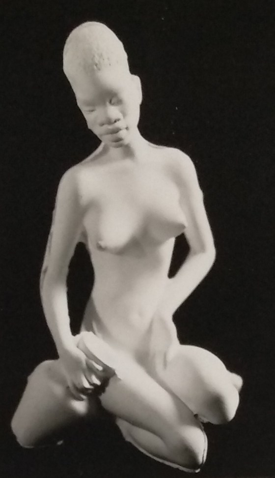White unpainted chalkware lady figurine