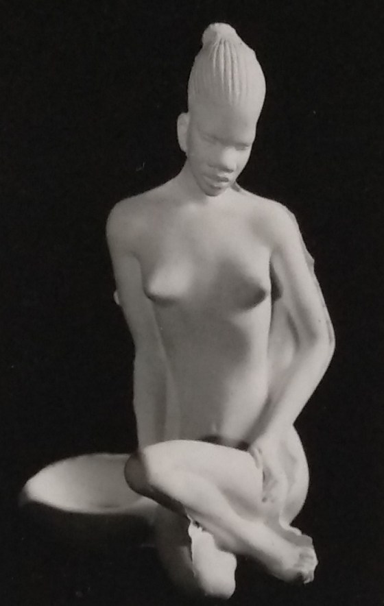 White chalkware unpainted lady african style figurine