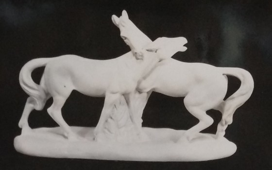 Two horse figurine entwined at the neck