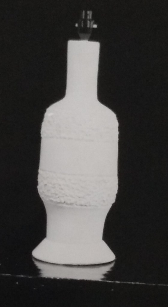 White standard lamp with small flat pattern and raised rough glaze along top and bottom