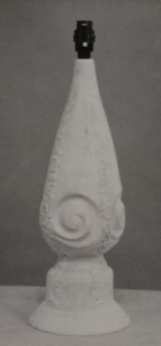 White standard lamp with bayonet fitting and swirl embossed logo around the base