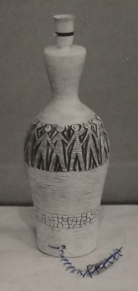 White standard lamp with a band of human stick figures