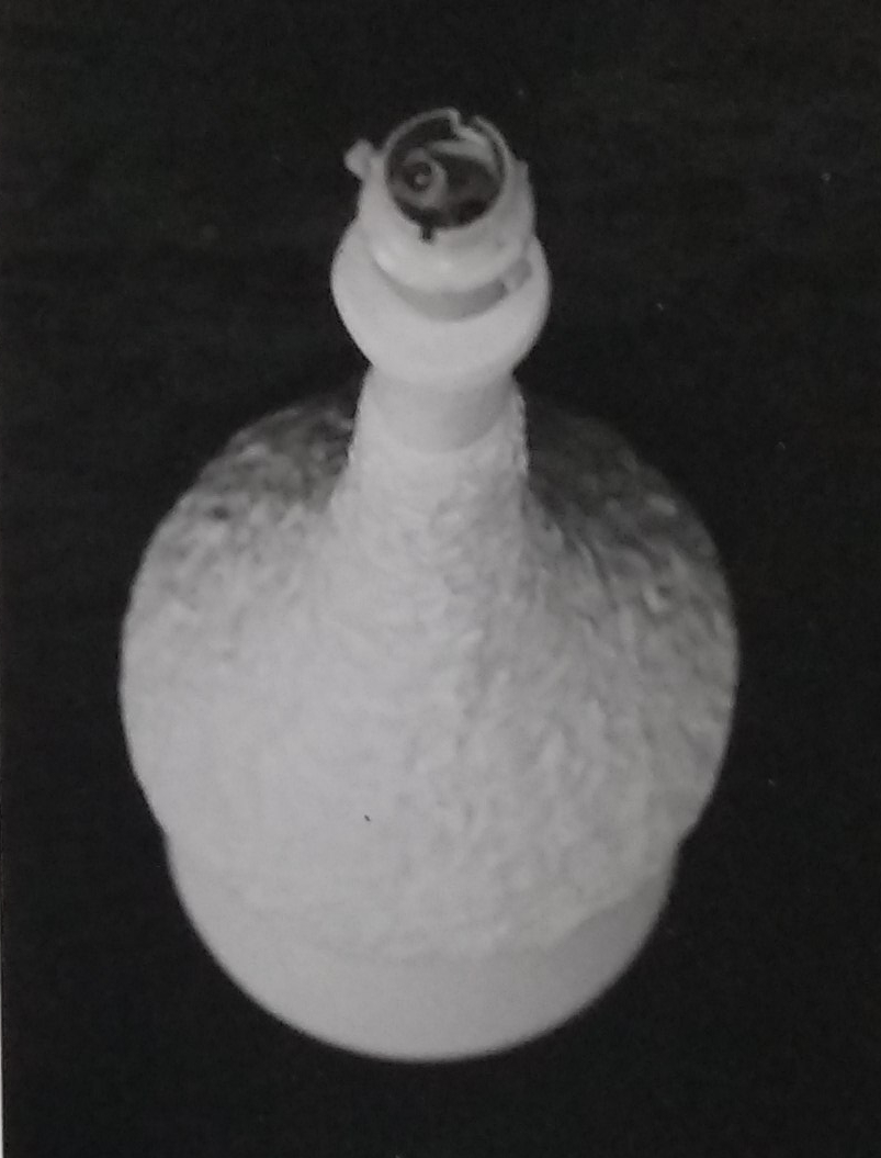 White standard lamp with random pattern over the surface