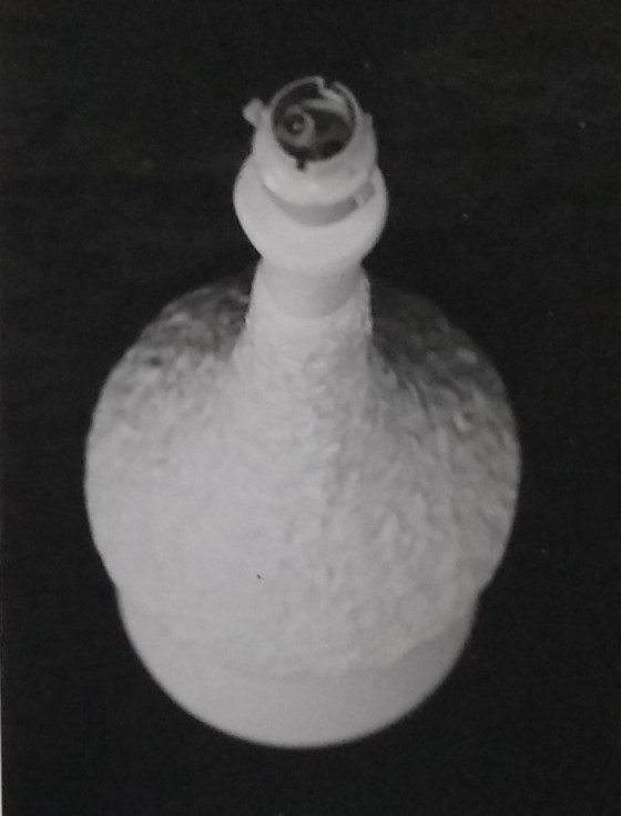 White standard lamp with random pattern over the surface