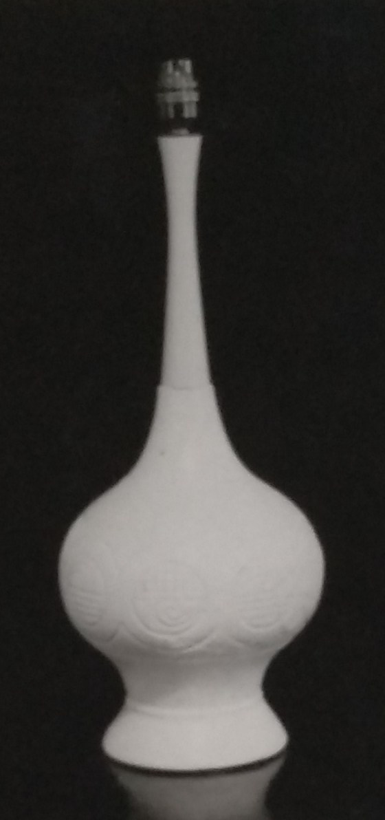 White standard lamp with tall neck and wide spherical base